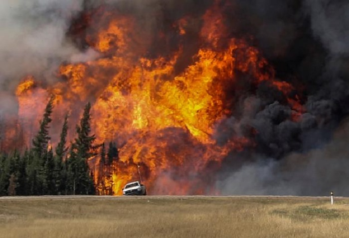Canada hopes cooler weather aids battle with Alberta wildfire